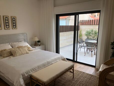 Abdoun, Apartments/Houses, JOD 13000/year,  Furnished,  2 BR,  Discover Your Perfect Ground-floor Haven In The Heart Of Abdoun
