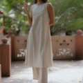 INR 1050,  Shop Cream Cotton Sleeveless A-Line Kurta Set For Women