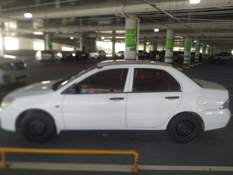 Abu Dhabi, Vehicles, Cars & Trucks , AED 4000,  Mitsubishi Lancer,  2006,  Automatic,  590000 KM,  &bull;	Old Car But Working,  1.3L Basic, Model , Odometer 590K Km