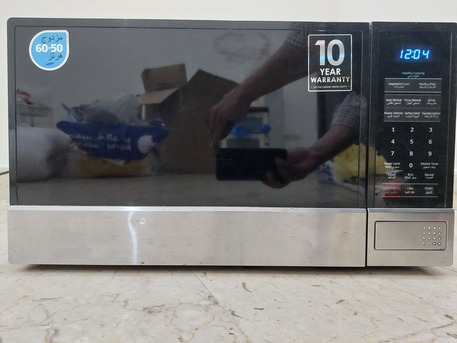 Dhahrat Laban, Appliances, SAR 225,  Samsung Microwave Oven - 32 Liters - Stainless Steel - Good Working Condition