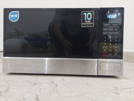Dhahrat Laban, Appliances, SAR 225,  Samsung Microwave Oven - 32 Liters - Stainless Steel - Good Working Condition