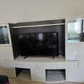 SAR 800,  An Home Center TV Stand With Attached Cabinet And Drawer