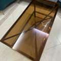 SAR 1000,  Elegant Bronze-Tinted Glass Coffee Table With Golden Frame &ndash; Stylish Living Room Table