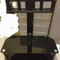 BHD 35,  BLACK GLASS TV STAND URGENT SALE 35 BHD Negotiable