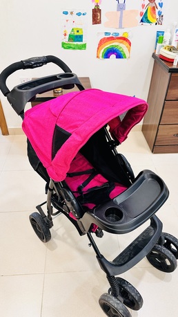 Tubli, Baby & Kid Stuff, BHD 17,  Juniors Baby Stroller (Excellent Condition) &ndash; Vibrant Pink! BD 17