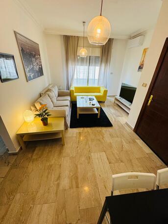 Amman, Apartments, Flats, Houses & Villas, JOD 9000/year,  Furnished,  2 BR,  83 Sq. Meter,  2-Bedroom Fully-Furnished Apartment With Balcony For Rent In Deir Ghbar, Amman - Jordan