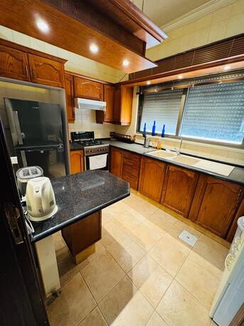 Amman, Apartments, Flats, Houses & Villas, JOD 9000/year,  Furnished,  2 BR,  83 Sq. Meter,  2-Bedroom Fully-Furnished Apartment With Balcony For Rent In Deir Ghbar, Amman - Jordan