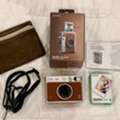 BHD 75,  Fujifilm Instax Mini Evo Hybrid Instant Camera (BROWN) With Free Instax Film Mini 10 Sheet