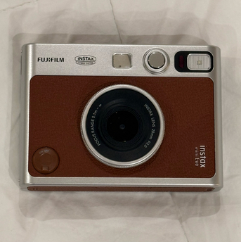 Manama, Electronics, BHD 75,  Fujifilm Instax Mini Evo Hybrid Instant Camera (BROWN) With Free Instax Film Mini 10 Sheet
