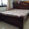 BHD 18,  Traditional King Size Wooden Bed With Spring Mattress For Sale.