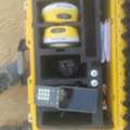 Land Surveyor With GPS And Level Machine