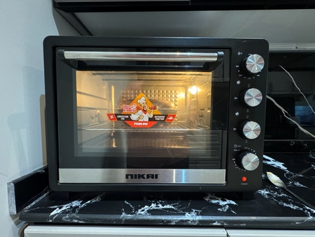 Riyadh, Appliances, SAR 350,  New Electric Oven Nikai 65 Liter 2200W Rotisserie Convection Keep Warm 2 Years Warranty