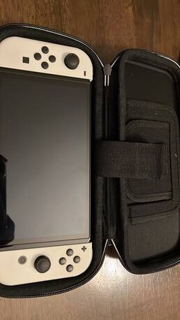 Abraq Ul Raghama, Video Games, SAR 1250,  Nintendo Switch OLED White Edition + Zelda + Rayman + Case &ndash; Excellent Condition