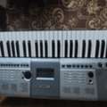 SAR 300, YAMAHA Piano PSR I425 With Stand And Carrying Pouch.