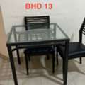 BHD 13,  Metallic Dining Table With Glass Top And 2 Wooden Chairs