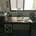 Office Set-up Or Computers With Tables, Bookshelf And Chairs