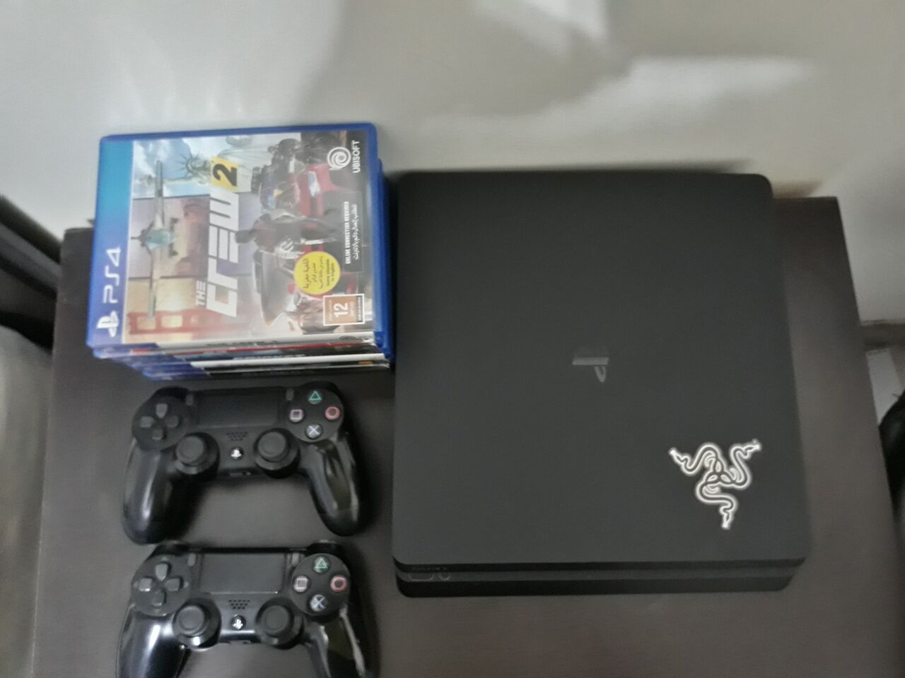 Riyadh, Electronics, SAR 1150,  PS4 Slim 1TB + 2 Controllers + 7 Games | Excellent Condition