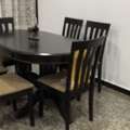BHD 190,  Dining Room Solid Wood Dark Brown Table With 6 Chairs, 135 X 95 X 75. Price Is Negotiable