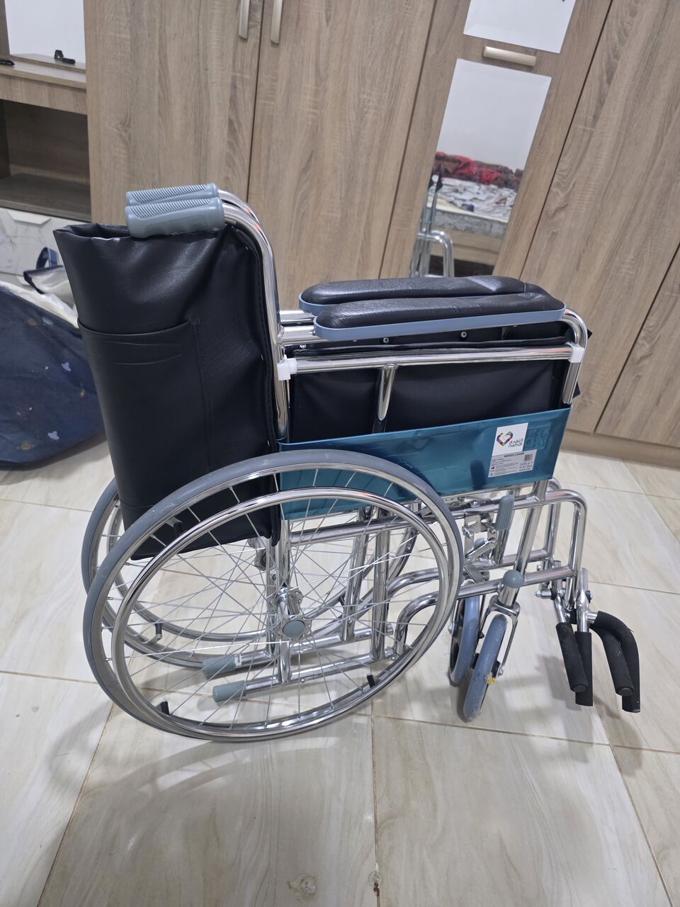 Al Rakah Al Janubiyah, Furniture, SAR 200,  Foldable Chrome Wheelchair With Self-Propelling Wheels - New And Only Used For Two Weeks